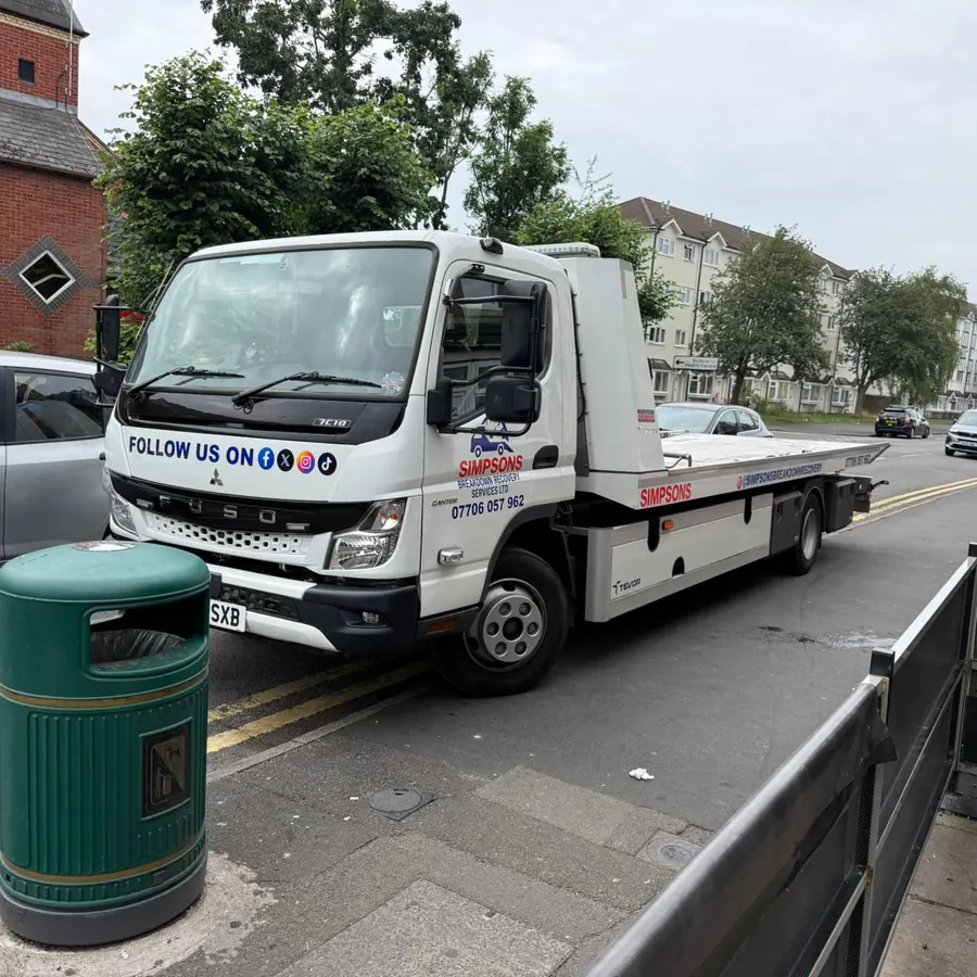 Simpsons Breakdown Recovery Canter flatbed truck on call on a residential street in Birmingham