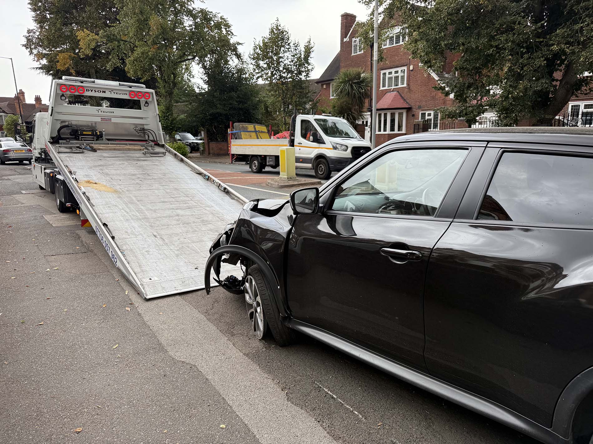 Crashed Nissan Juke getting loaded onto a recovery truck